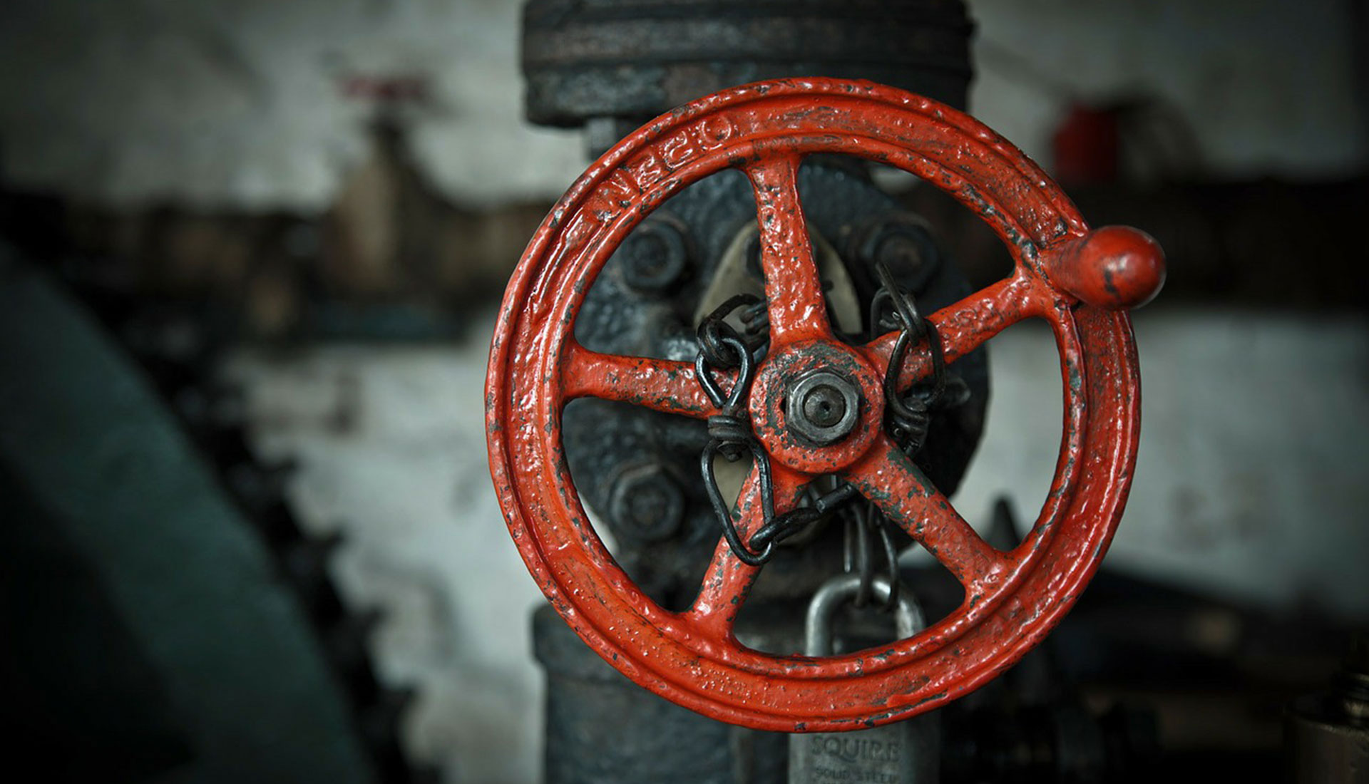 red valve with metal pipe